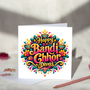 Happy Bandi Chhor Divas greeting card with colourful pink and gold lettering, glowing diyas, flowers and teal leaves on a white background