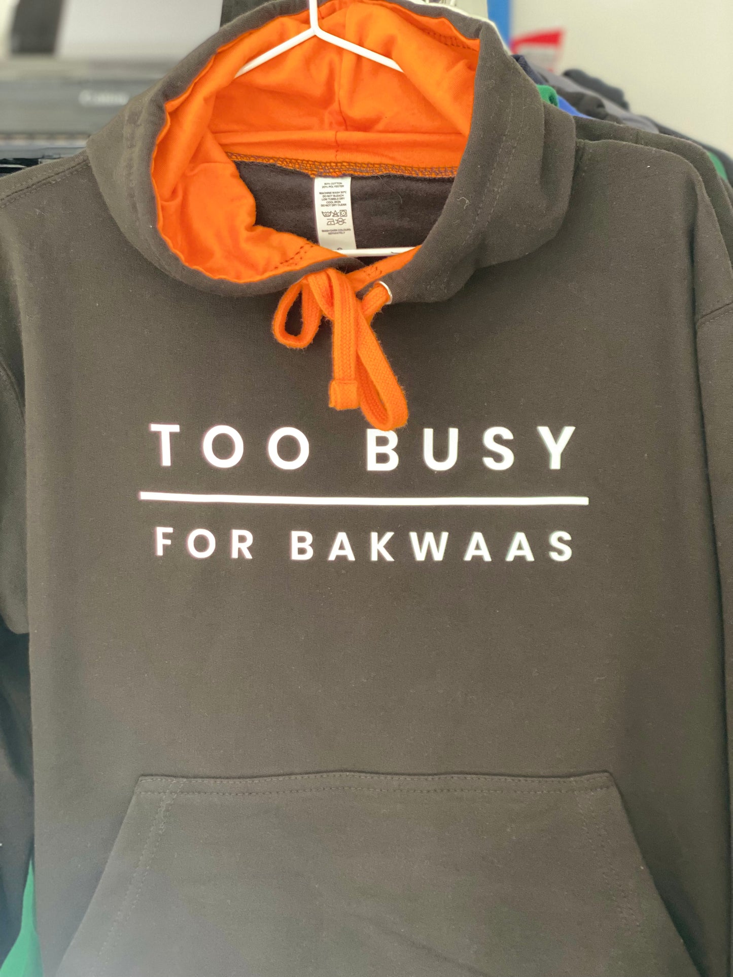 
                  
                    Too Busy For Bakwaas Unisex Black Hoodie with Orange Contrast
                  
                