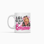White mug with an illustrated woman in a pink hijab, sunglasses on her head and the words “Life’s too short for Bakwaas” in black and pink lettering